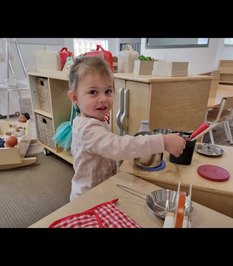 A little girl playing at our daycare centre