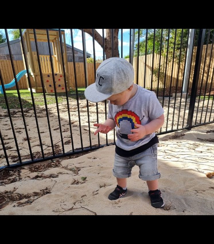 A little boy playing outside at our early learning centre